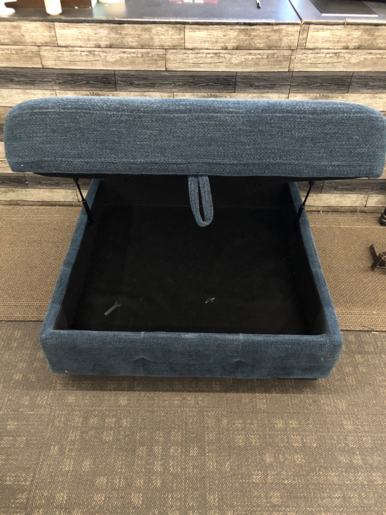 BLUE FABRIC STORAGE OTTOMAN.