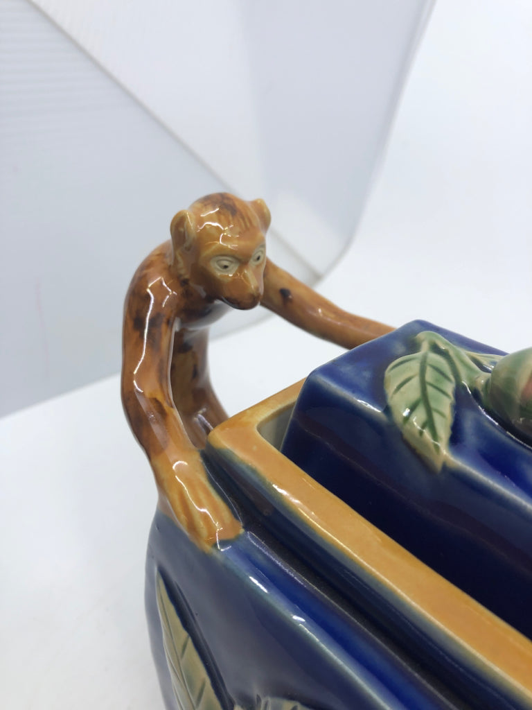 MAJOLICA STYLE TEAPOT W/ EMBOSSED PINK FLOWERS MONKEY AS HANDLE NUMBERED.
