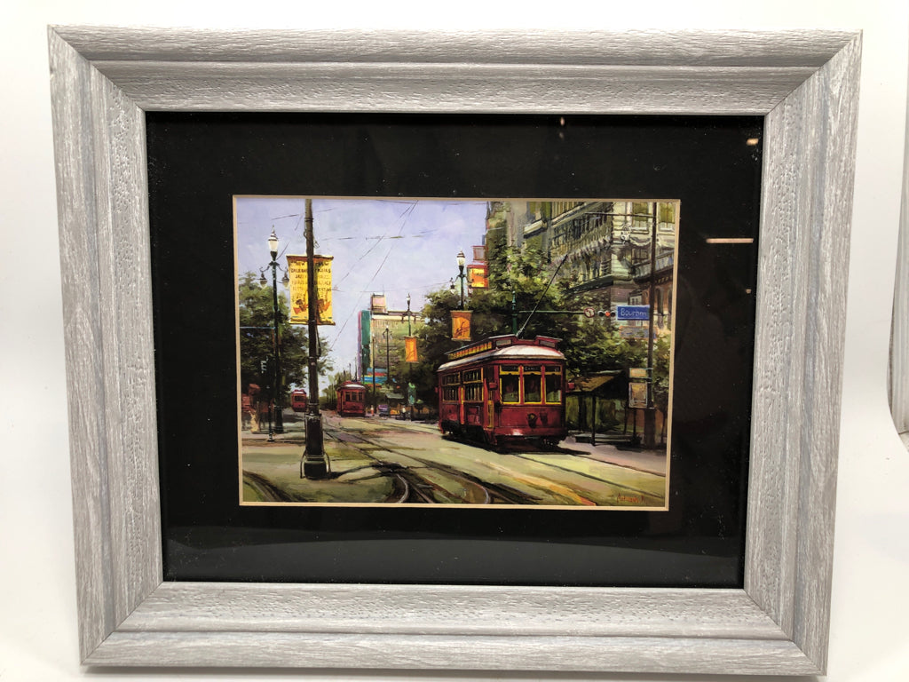 TROLLEY CAR PRINT IN GREY WASH FRAME.