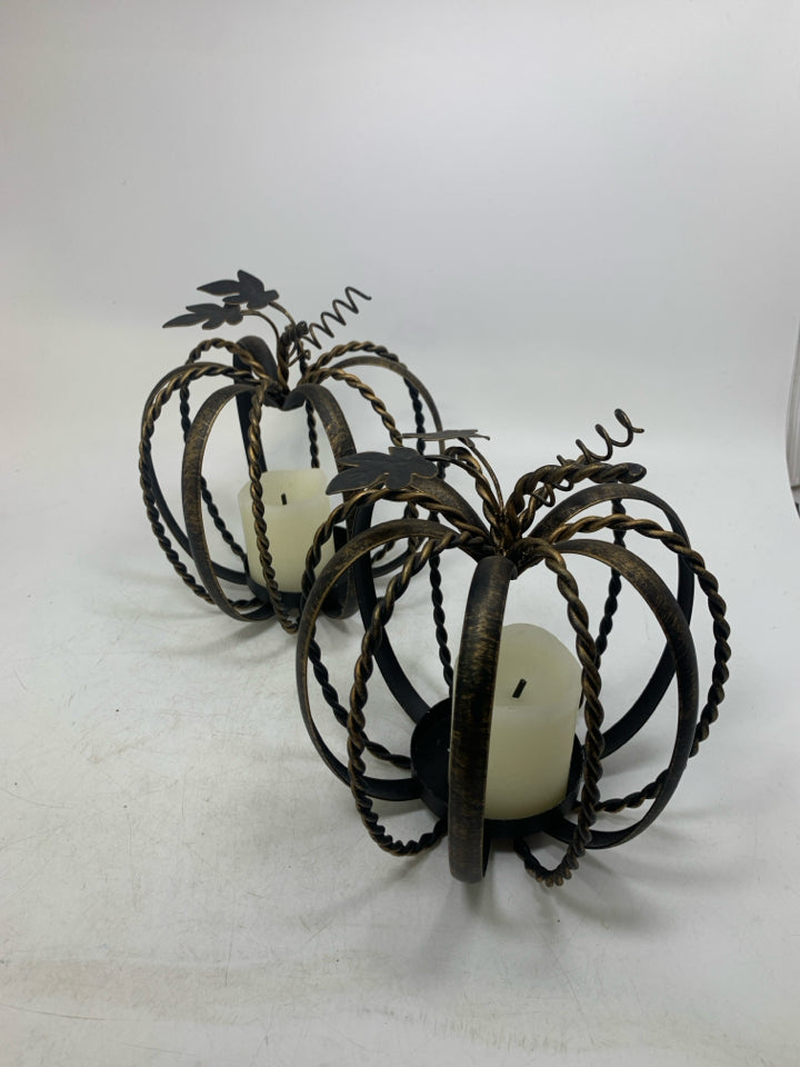2 METAL PUMPKIN CAGE PILLAR CANDLE HOLDERS BRONZE W/ FAUX CANDLES.