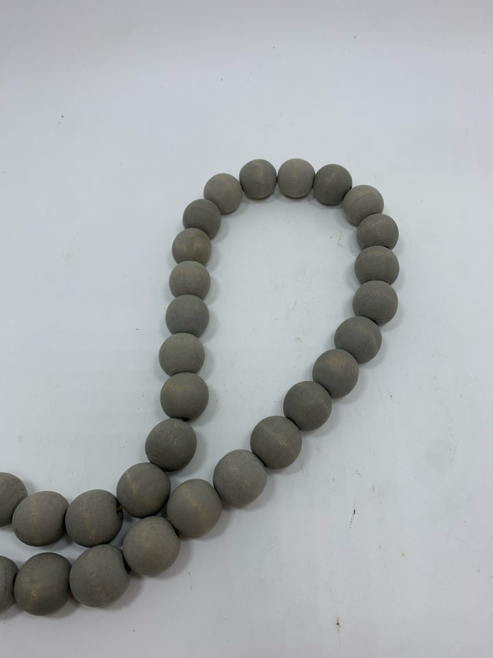 GRAY WOOD BEADED GARLAND.