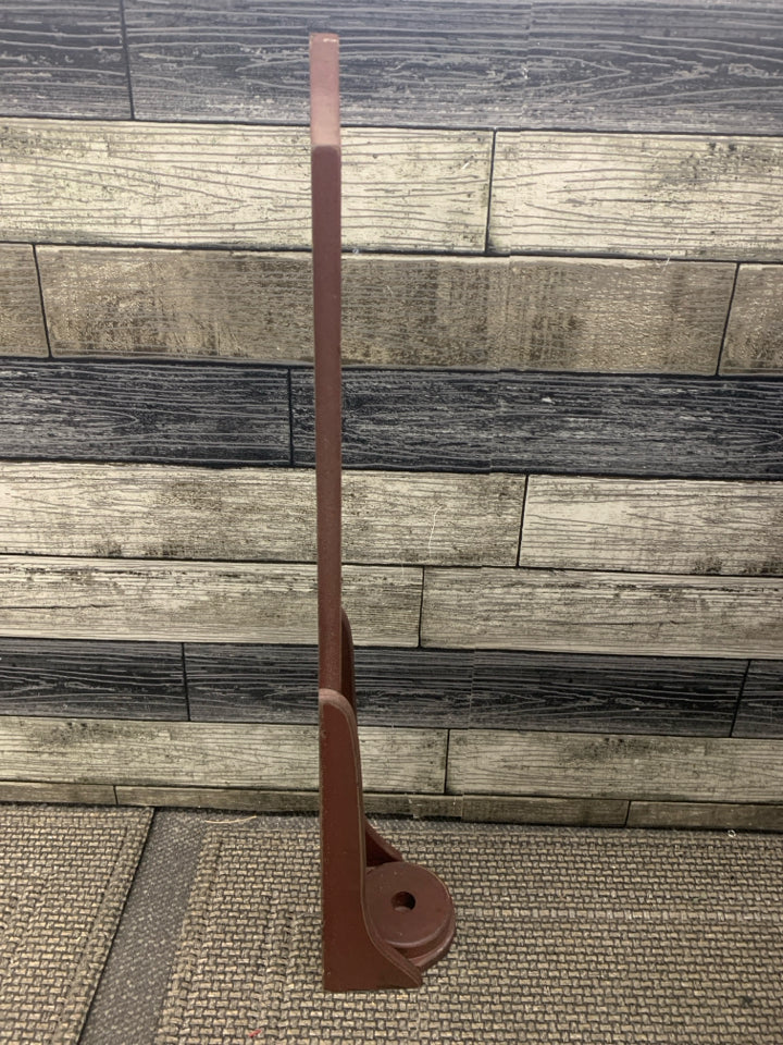 RED PRIMITIVE CANDLE HOLDER W STAR CUT OUT.