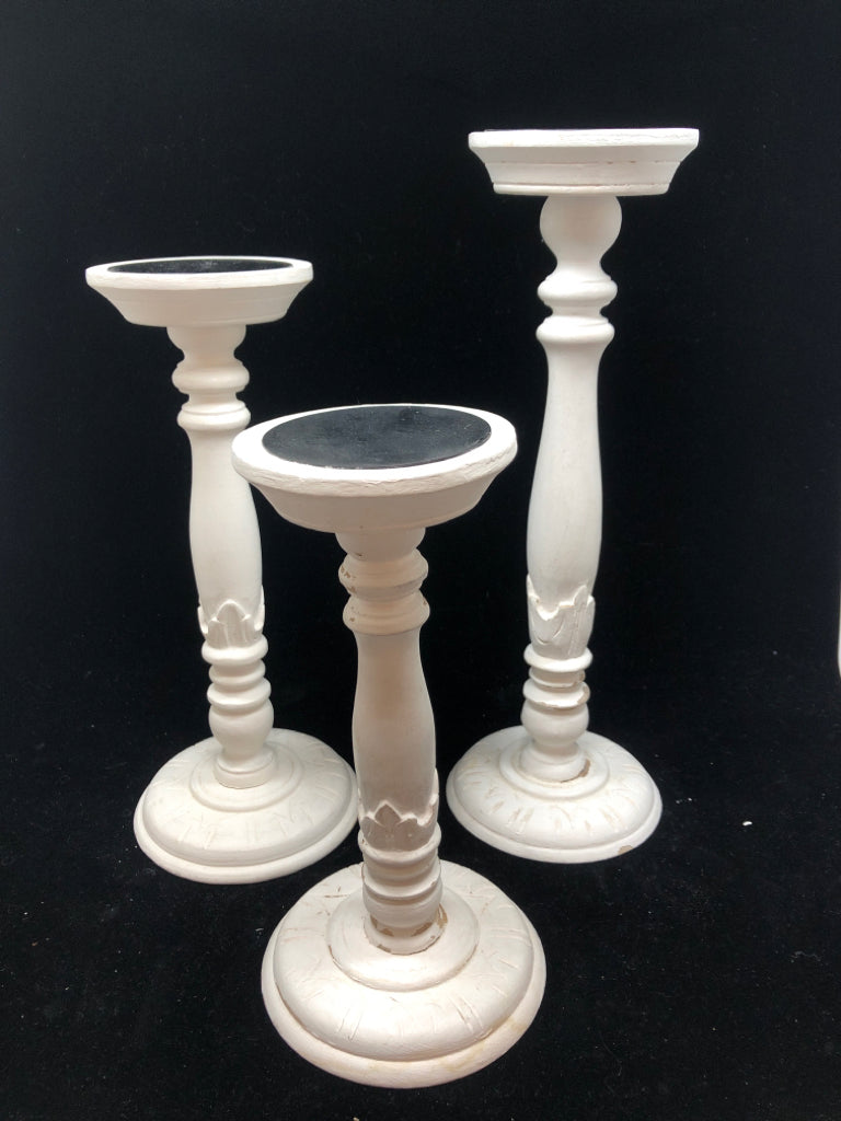 3 DISTRESSED WOODEN CANDLE STICK HOLDERS.
