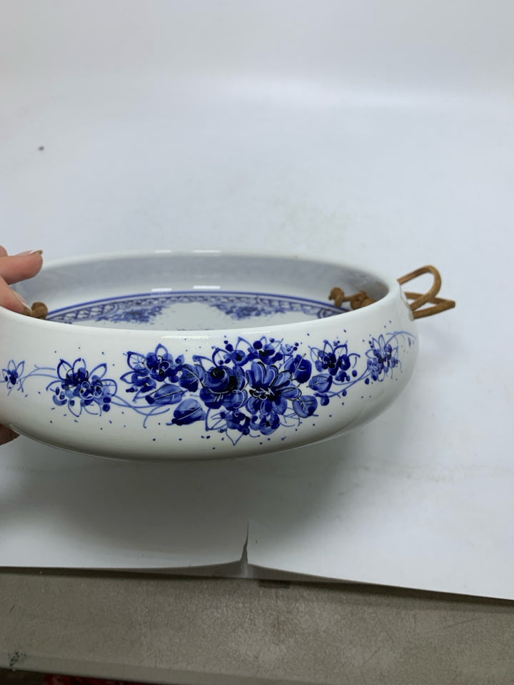 WHITE DEEP CERAMIC TRAY W/ BLUE FLORAL DESIGN LEATHER HANDLES.