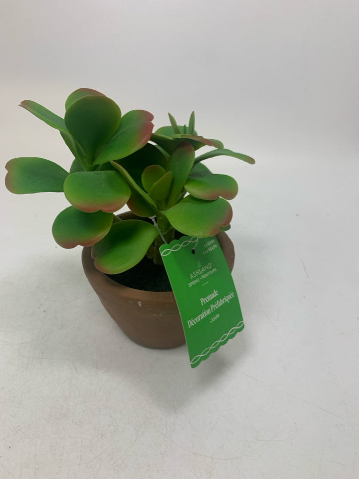 NWT BROWN SMALL PLANTER W/ FAUX LEAVES.