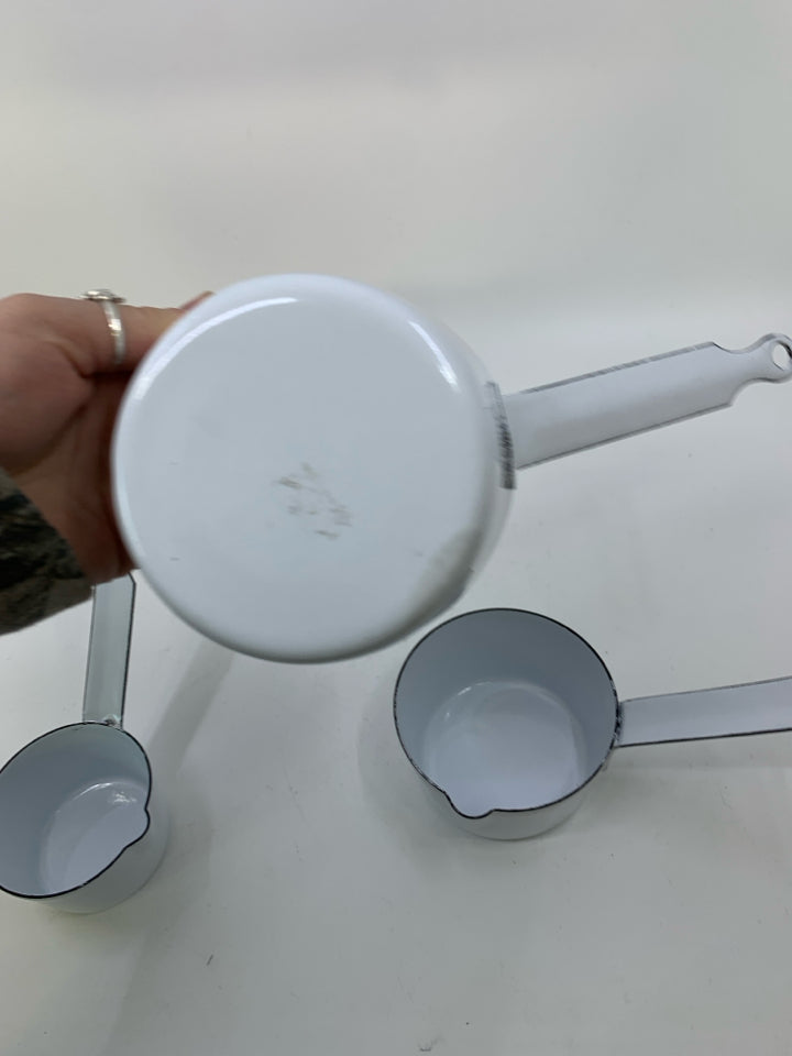 3 HEAVY NESTING ENAMEL WHITE SAUCE PANS.