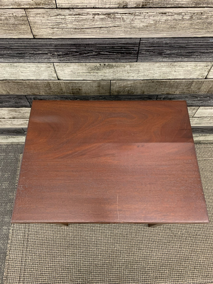 RED WOODEN SIDE TABLE.