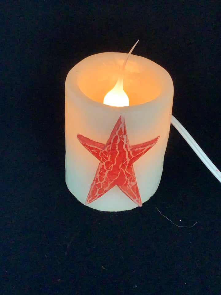 PRIMITIVE RED STAR FAUX LIGHT UP CANDLE.
