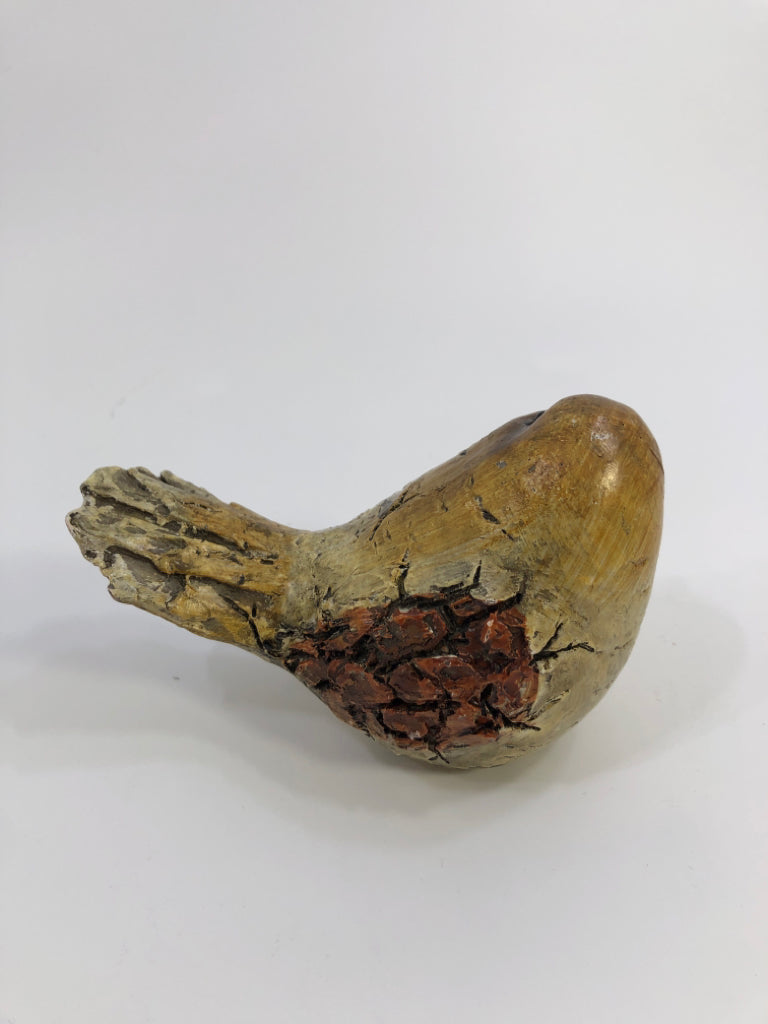 SMALL TEXTURED BROWN BIRD.