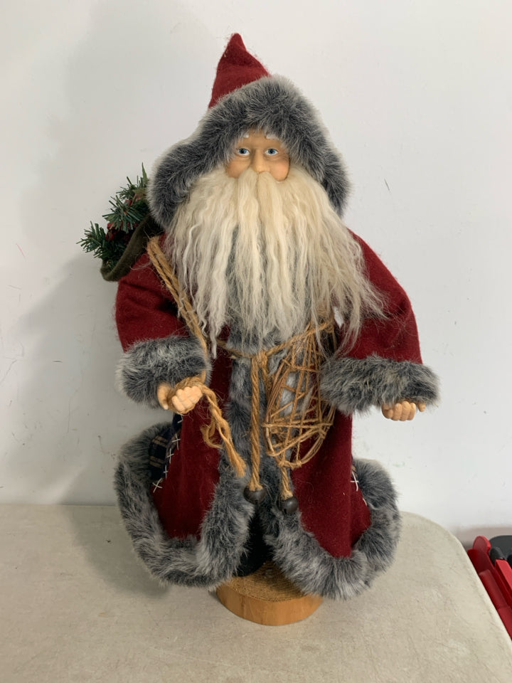 MAROON/FUR COAT STANDING SANTA W/ SNOWSHOES.