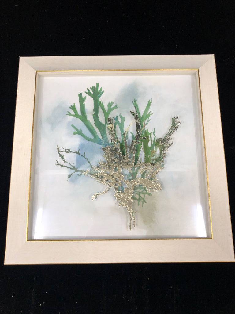 CORAL IN WHITE FRAME W/ GOLD EDGES.
