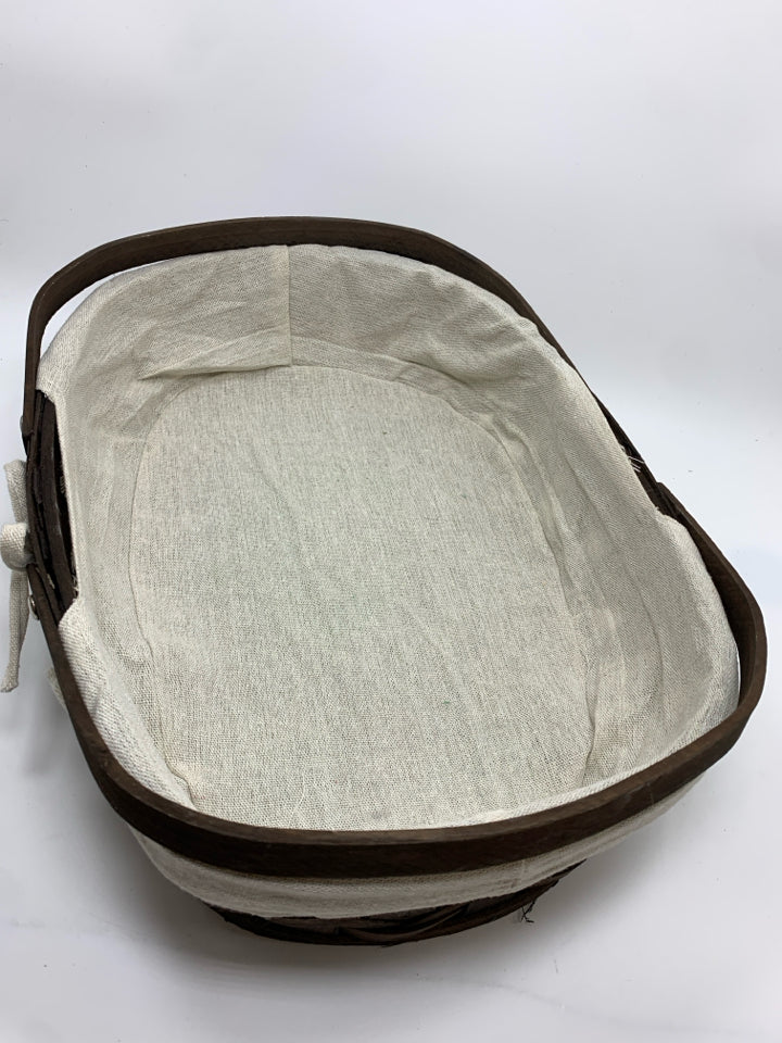 BROWN SHALLOW BASKET W/FABRIC LINING 2 HANDLES.