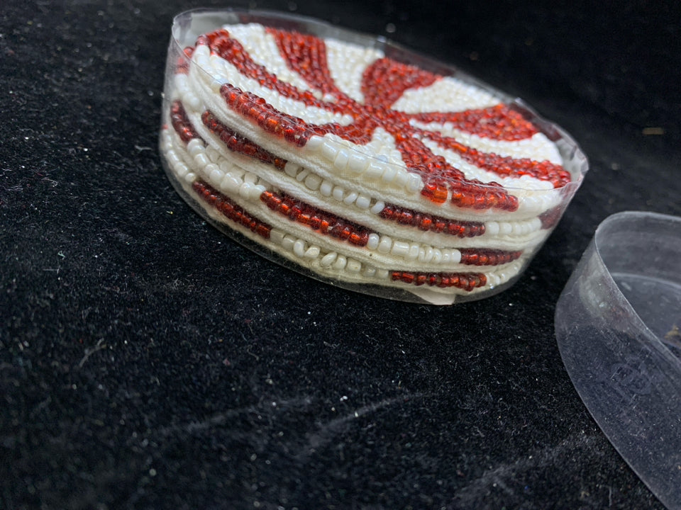 4 NIP RED SWIRL BEADED COASTERS.