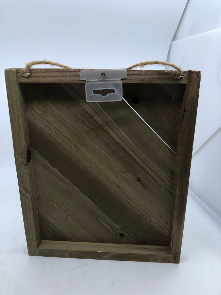 WOOD SIGN WITH WHITE PAINTED LEAVES/FLOWERS.