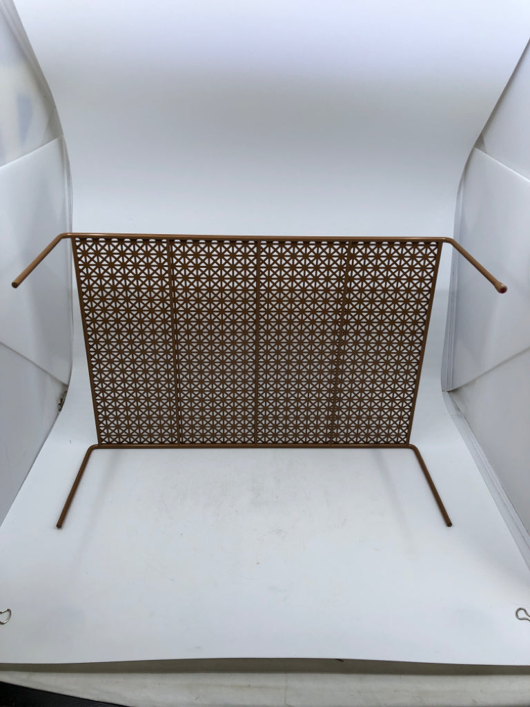 LIGHT BROWN METAL CABINET SHELF ORGANIZER W/ TRIANGLE PATTERN.