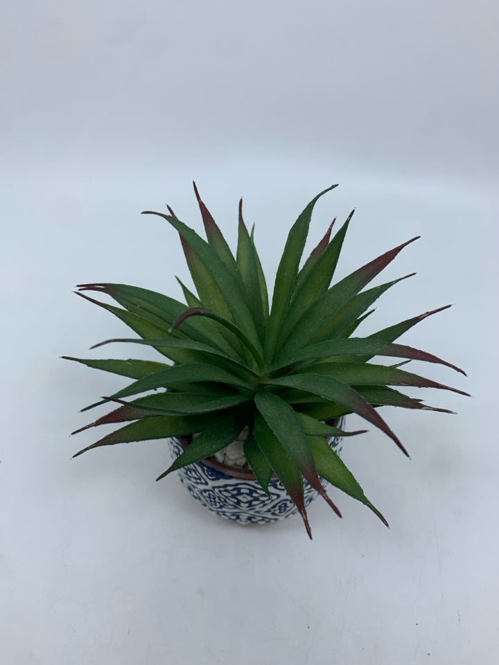 FAUX SUCCULENT IN BLUE AND WHITE CERAMIC POT.
