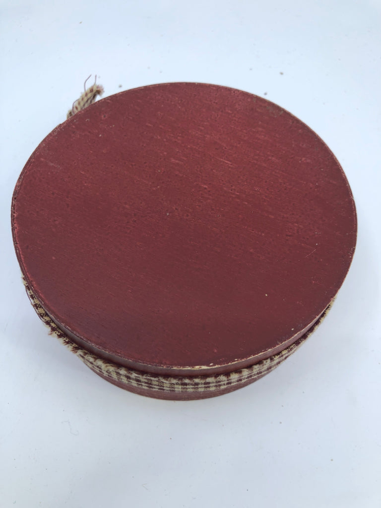 ROUND RED BOX W PLAID RIBBON.