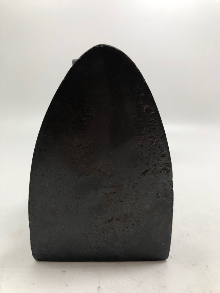 BLACK SAD IRON DOOR STOP.