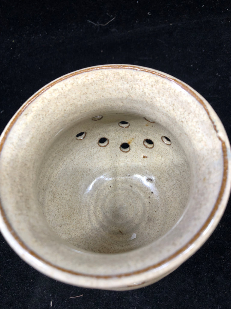 GRAY POTTERY TEA LIGHT HOLDER.