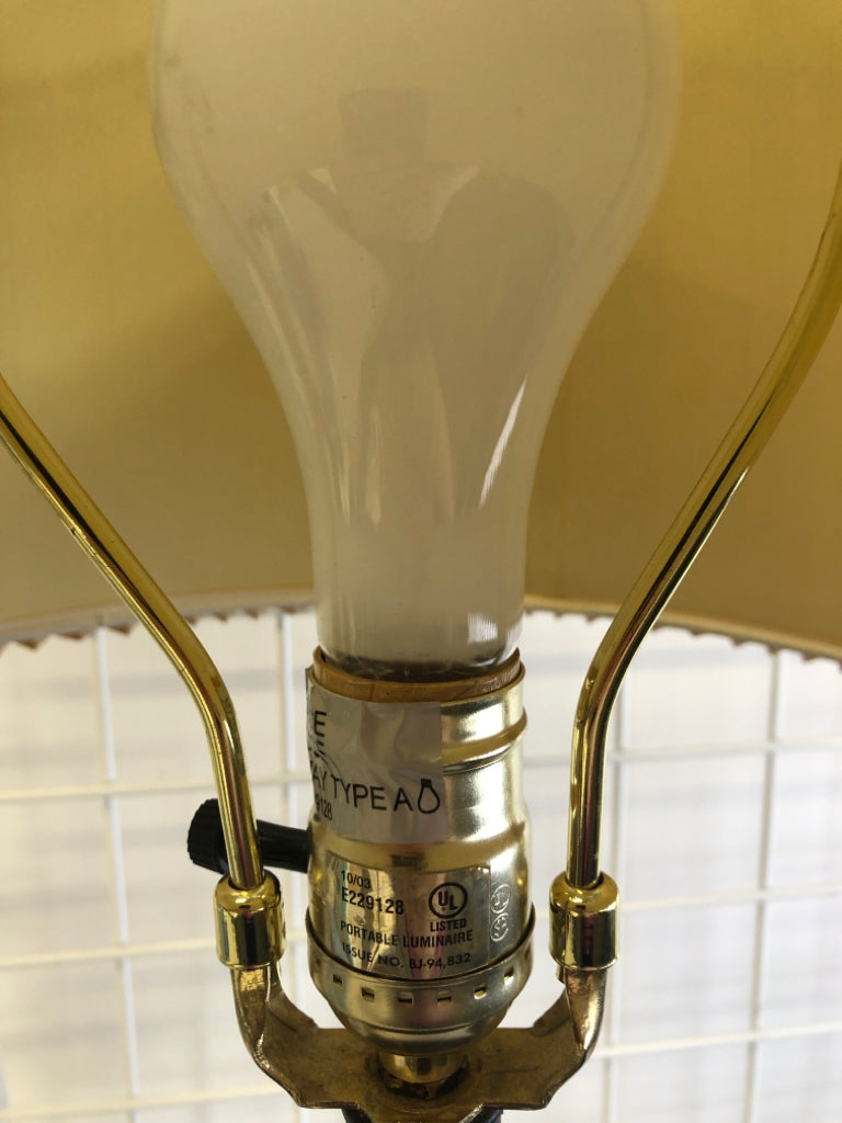 BROWN/GOLD LEAF LAMP BASE W/TAN ACCORDION SHADE.