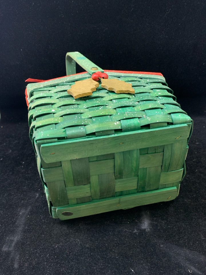 GREEN HOLIDAY BASKET W/ RED LID HOLLY DESIGN WHITE SPECKLES.