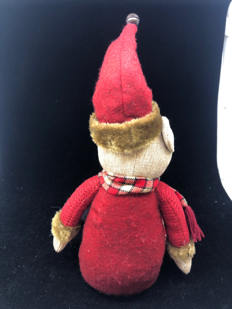 SHELF SITTING TEDDY IN RED COAT.