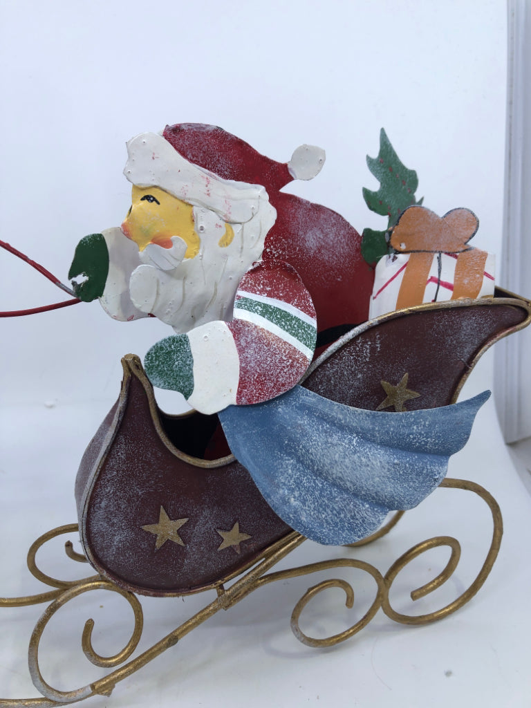 METAL SANTA IN SLEIGH CANDLE HOLDER.