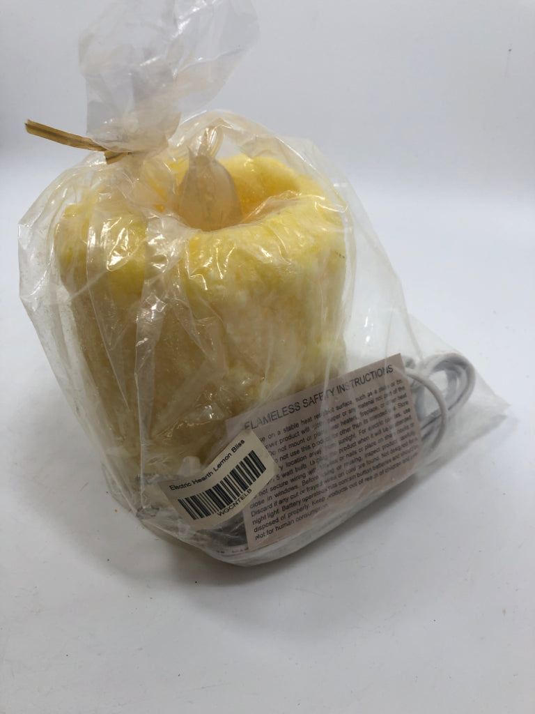 NIP YELLOW GLOW LIGHT UP CANDLE LEMON BLISS.