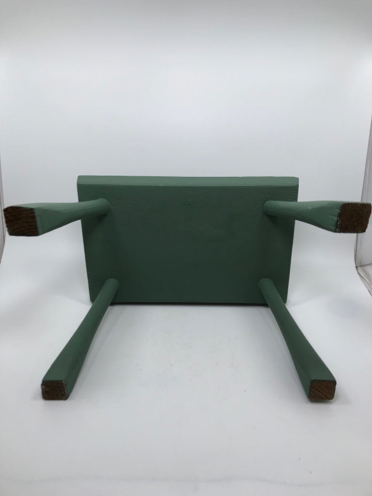 SM WOODEN GREEN FOOT REST STOOL.