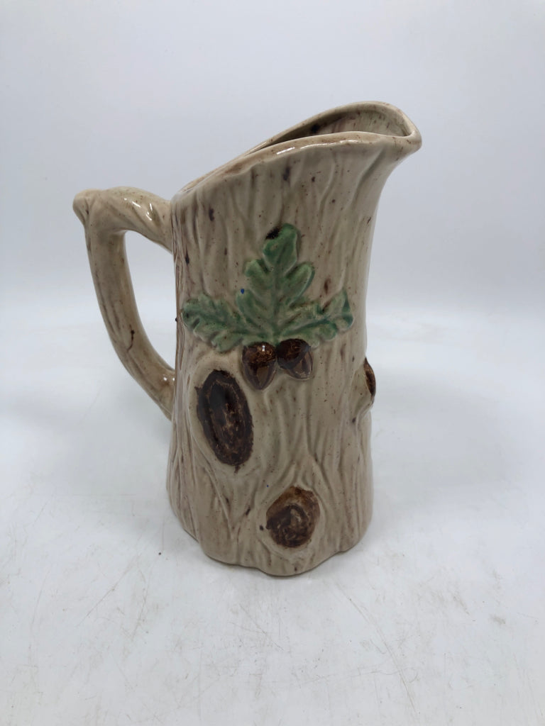 TREE TRUNK PITCHER W/ EMBOSSED MUSHROOMS.