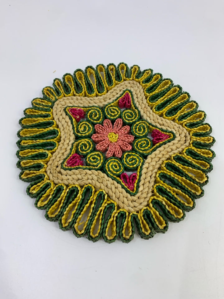 ROUND WOVEN GREEN/YELLOW PINK FLOWER STRAW TRIVET.