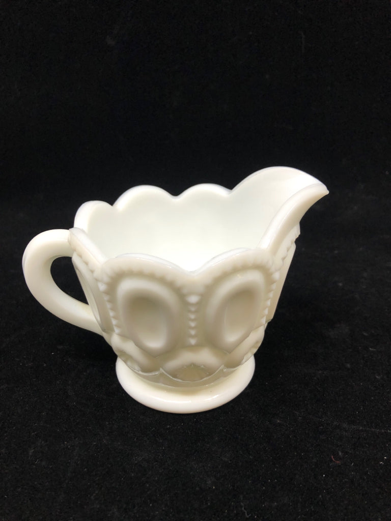 VTG MILK GLASS CREAMER W/CIRCLE PATTERN.