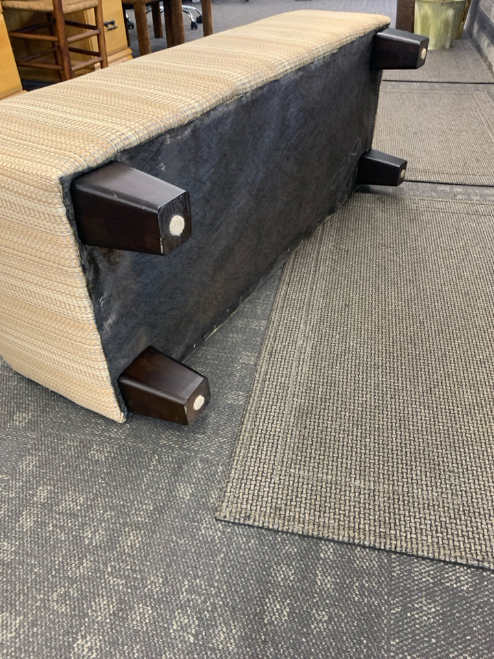 TAN OTTOMAN BENCH, SILK WEAVE TEXTURE W/BUTTON DETAIL.