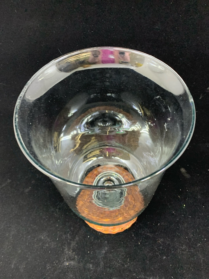 LARGE GLASS CENTERPIECE W/BROWN WICKER BASE.