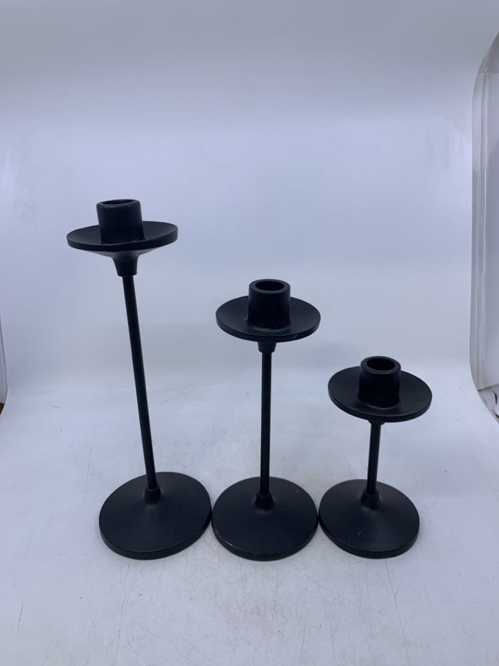 3 BLACK METAL TAPERED CANDLE HOLDERS.