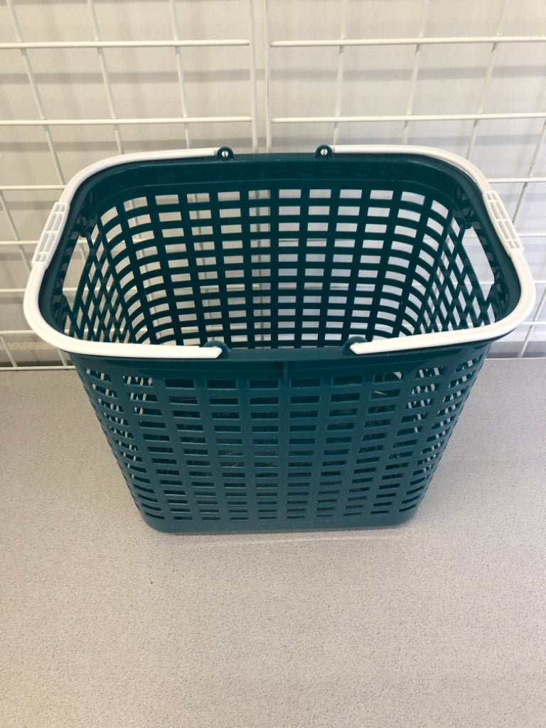 PLASTIC TEAL LAUNDRY BASKET W/WHITE HANDLE.
