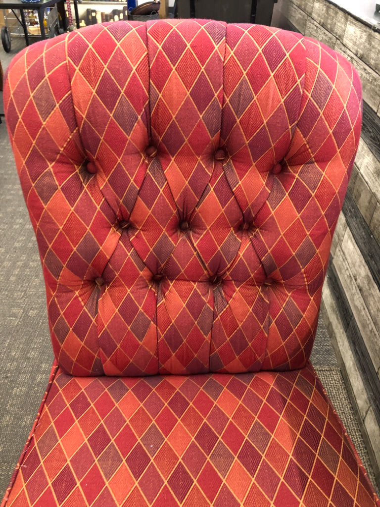 MULTI COLORED PRISM PATTERN FABRIC ACCENT CHAIR.