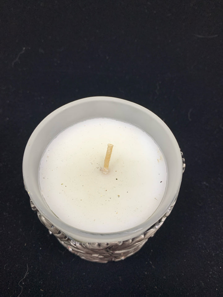 METAL LEAF COVERED CANDLE.