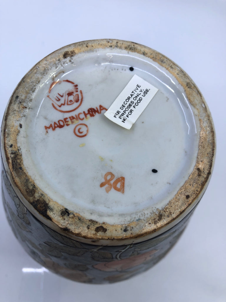 BLACK CERAMIC VASE W/ORANGE FLOWERS.