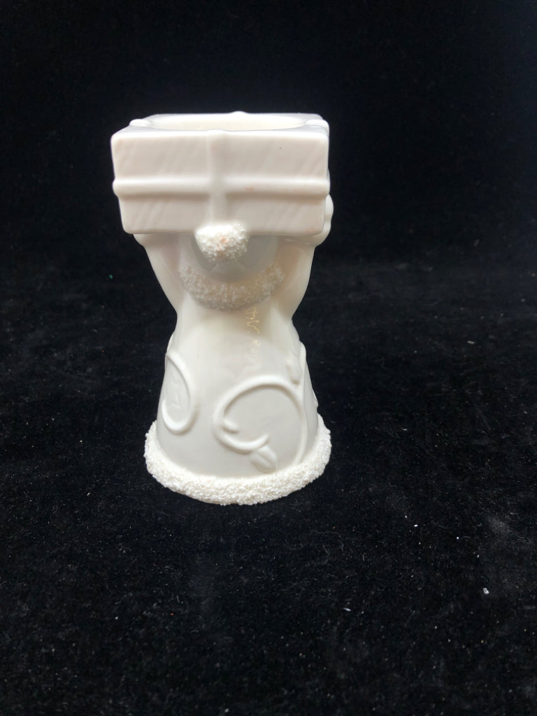 WHITE SANTA HOLDING PRESENT YANKEE CANDLE TEA LIGHT.
