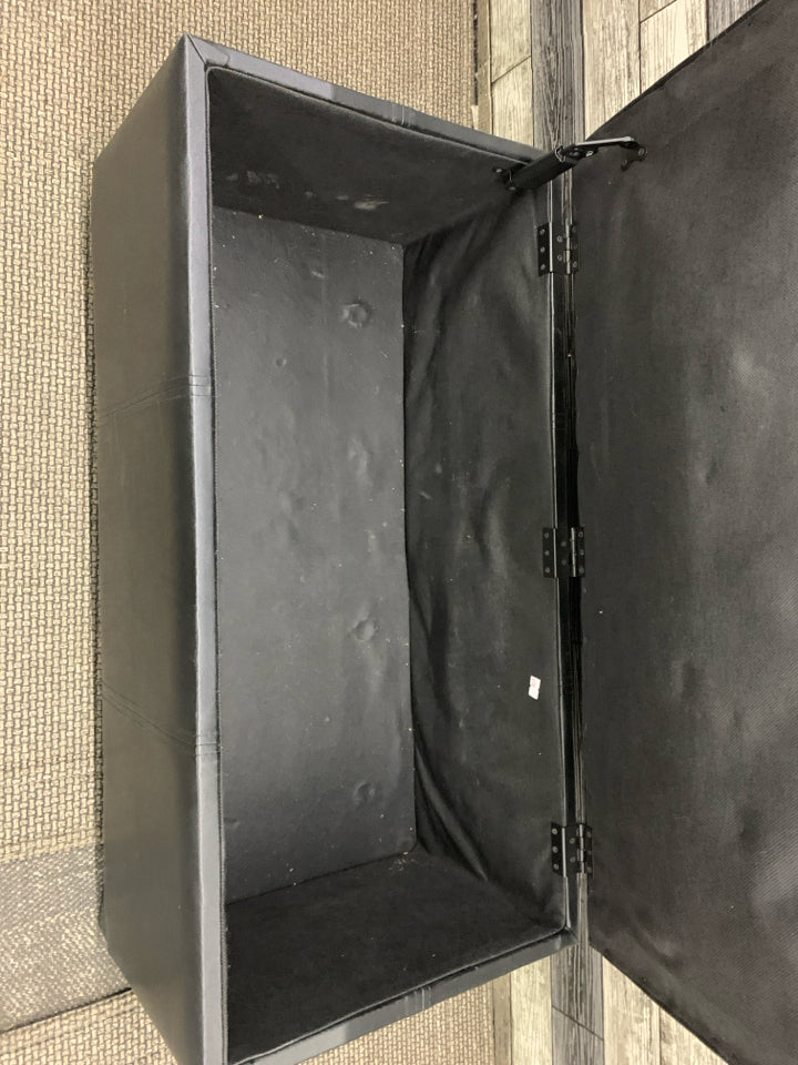 FAUX BLACK LEATHER BENCH W/ FLIP TOP STORAGE.