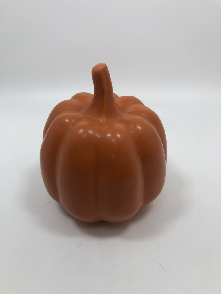 ORANGE CERAMIC PUMPKIN FIGURINE.
