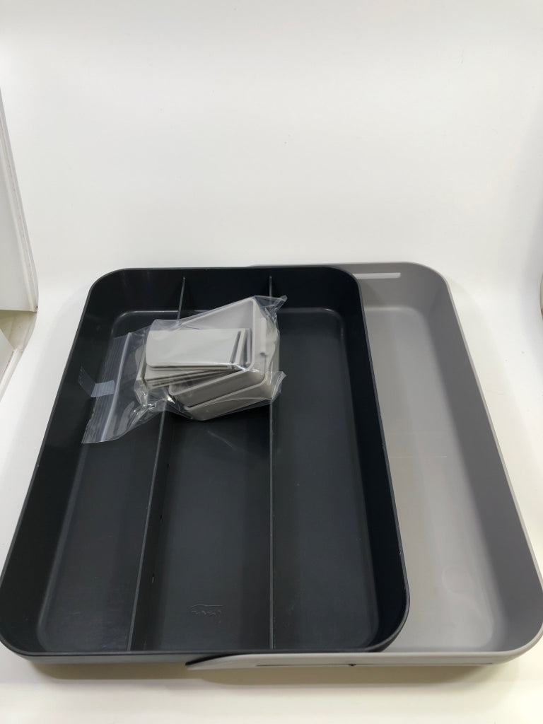 2-TONED GRAY SLIDE-OUT SNACK TRAY W/BAG OF DIVIDER ATTACHMENTS.