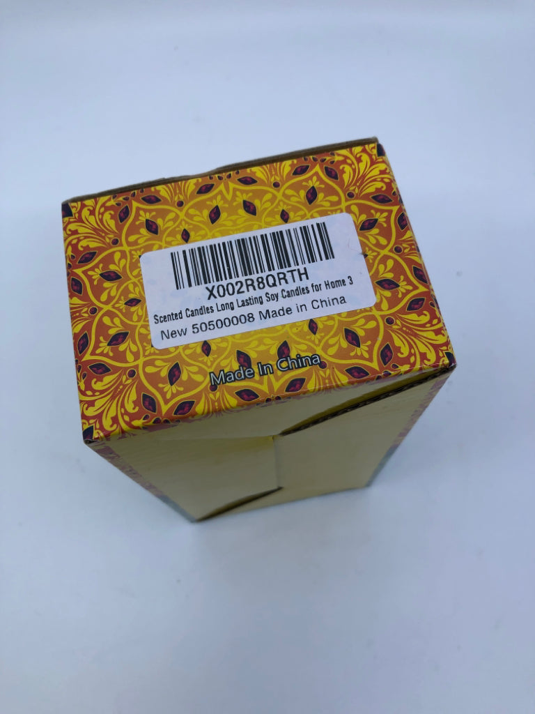 2 NIB SCENTED TIN CANDLES.