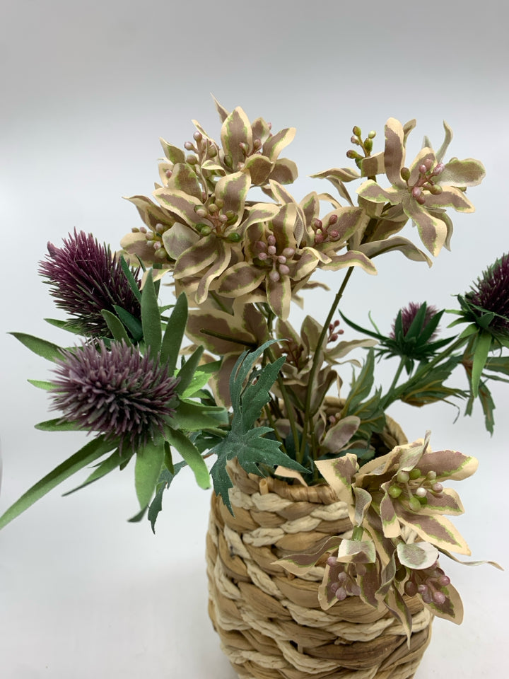 FLORAL MIX IN WICKER VASE.
