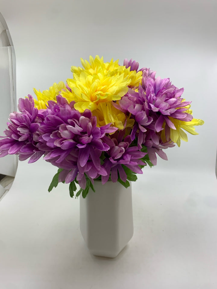 YELLOW & PURPLE FLOWERS IN WHITE VASE.