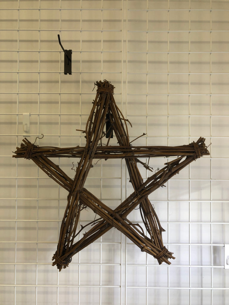 TWIG STAR SHAPED WALL HANGING.
