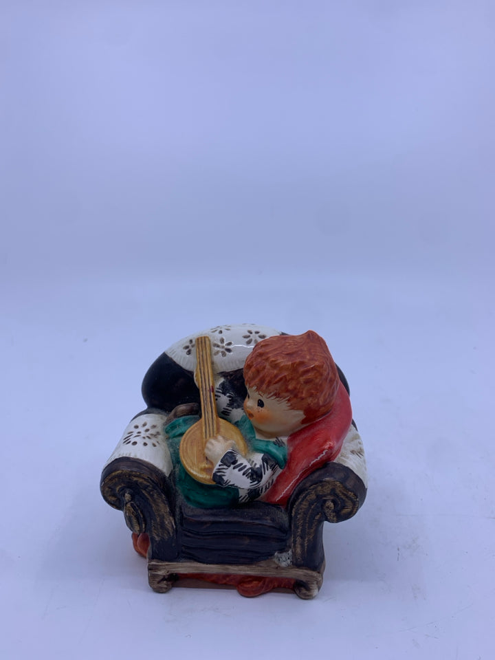REDHEAD KID PLAYING BANJO ON CHAIR FIGURE.