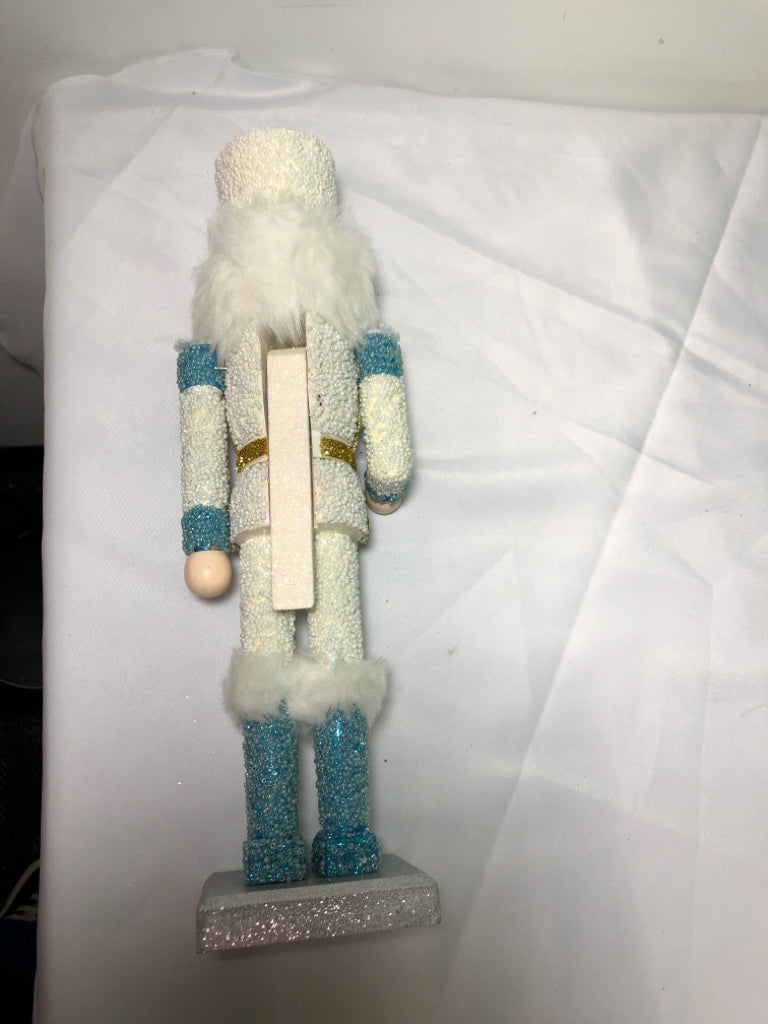 LIGHT BLUE AND WHITE SNOWFLAKE NUT CRACKER.