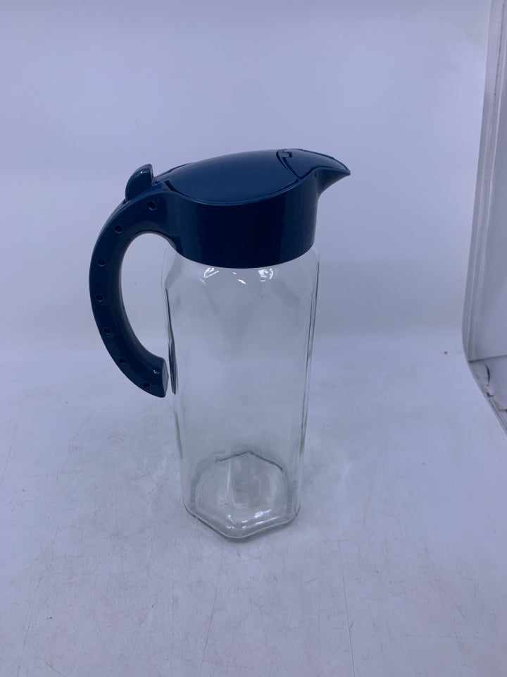 GLASS PITCHER W/ BLUE PLASTIC HANDLE/LID.